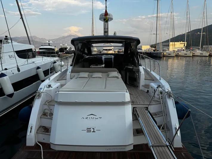  Yacht Photos Pics Azimut Atlantis 51 yacht, 2022 model, docked at marina with scenic mountain backdrop.