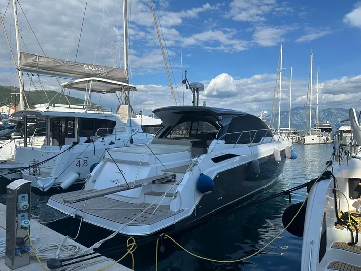  Yacht Photos Pics Azimut Atlantis 51 yacht docked in marina, 2022 model, clear sky background.