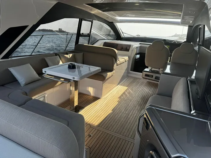  Yacht Photos Pics Luxurious interior of 2022 Azimut Atlantis 51 yacht with elegant seating and modern design.