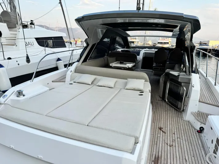  Yacht Photos Pics 2022 Azimut Atlantis 51 yacht with spacious deck and luxurious seating.