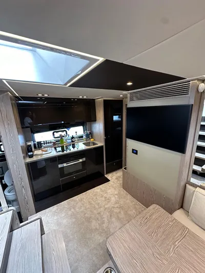  Yacht Photos Pics Luxurious interior of 2022 Azimut Atlantis 51 yacht, featuring modern kitchen and sleek design.