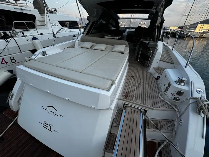  Yacht Photos Pics Azimut Atlantis 51 yacht, 2022 model, docked with spacious deck and luxurious seating.