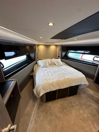  Yacht Photos Pics Luxurious bedroom interior of 2022 Azimut Atlantis 51 yacht with modern design.