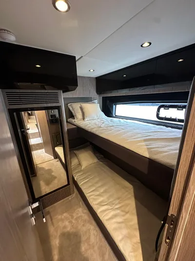  Yacht Photos Pics Interior of 2022 Azimut Atlantis 51 yacht with cozy bunk beds and modern design.
