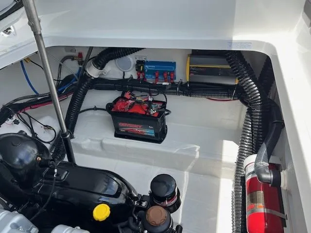 2025 Formula 290 Br Yacht Photos Pics 2025 Formula 290 Bowrider engine compartment with battery and fire extinguisher.