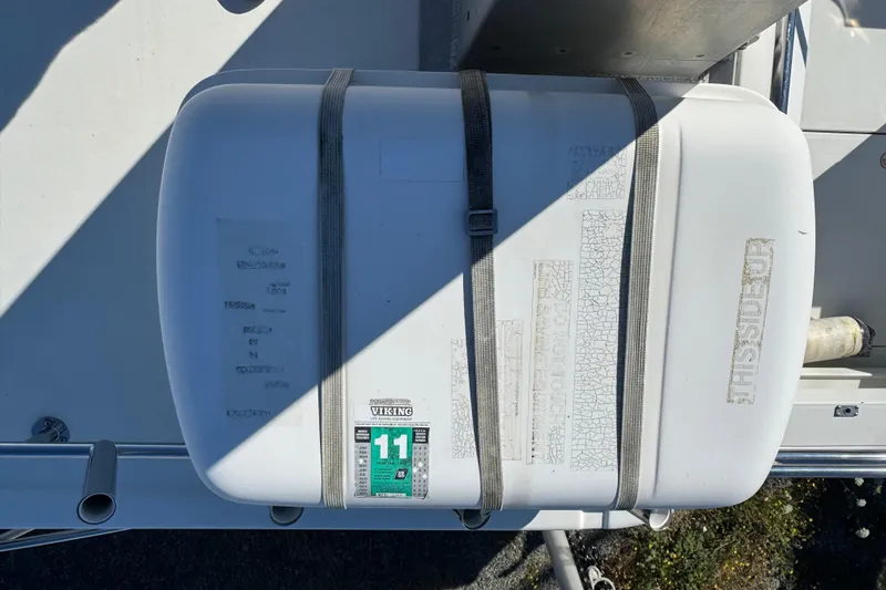  Yacht Photos Pics Life raft on 2005 Ocean Sport Roamer 30 boat deck, secured with straps.