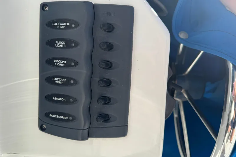  Yacht Photos Pics Control panel on a 2005 Ocean Sport Roamer 30 boat with labeled switches.