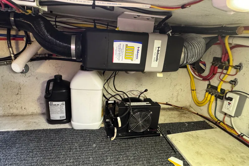  Yacht Photos Pics Engine room of 2005 Ocean Sport Roamer 30 with heating and electrical systems.