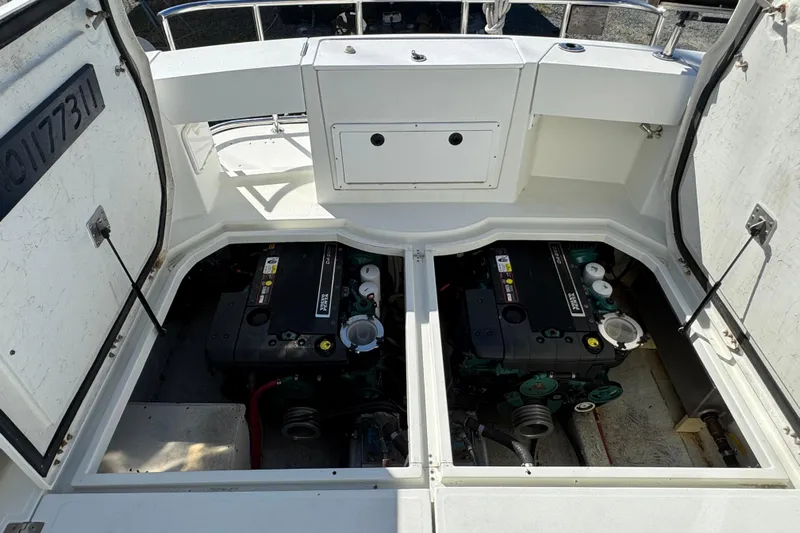  Yacht Photos Pics Engine compartment of a 2005 Ocean Sport Roamer 30 boat, showcasing dual engines.