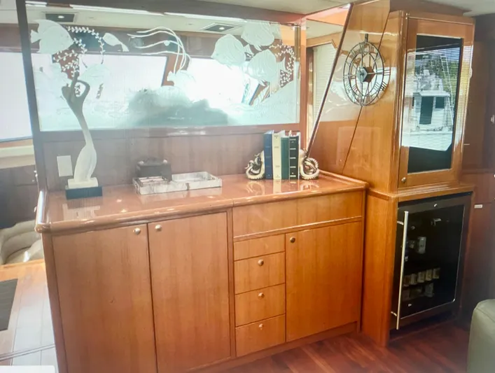  Yacht Photos Pics Interior of a 2000 Jefferson 56 Rivanna yacht with wooden cabinetry and decorative elements.