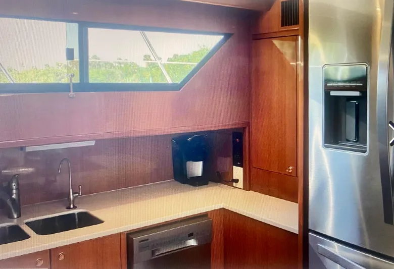  Yacht Photos Pics Modern kitchen in a 2000 Jefferson 56 Rivanna yacht with stainless steel appliances.