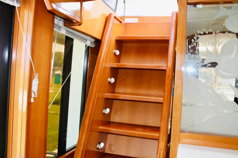  Yacht Photos Pics Wooden stairs inside a 2000 Jefferson 56 Rivanna yacht.