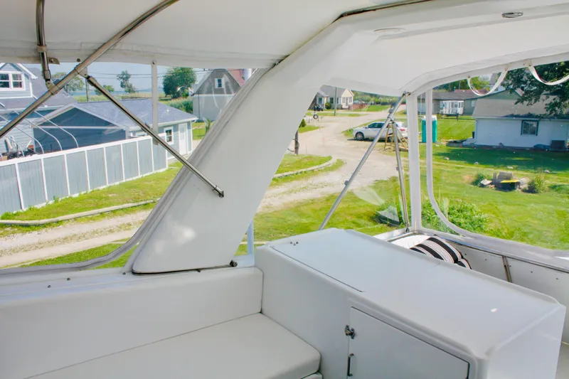  Yacht Photos Pics Interior view of 2000 Jefferson 56 Rivanna yacht with white seating and dashboard.