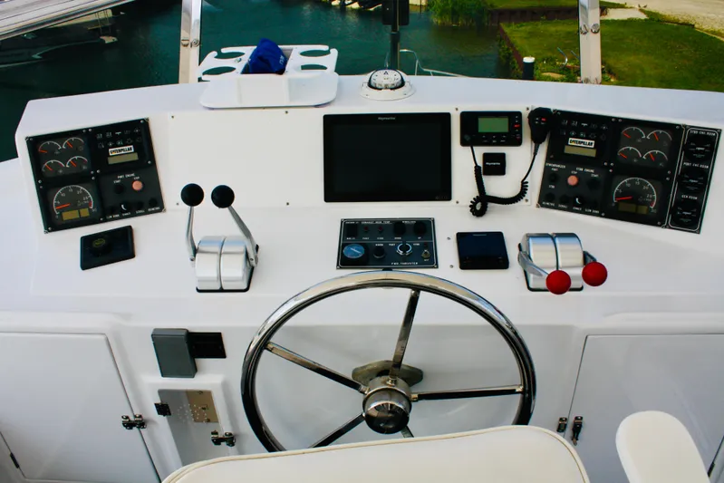  Yacht Photos Pics Control panel of a 2000 Jefferson 56 Rivanna yacht with steering wheel and navigation instruments.