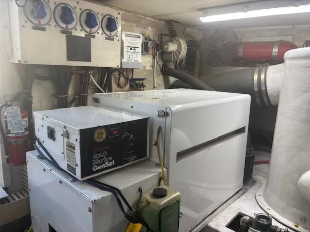 Dry-hydro Yacht Photos Pics Engine room of a 1990 Viking Convertible with generator and control panels.