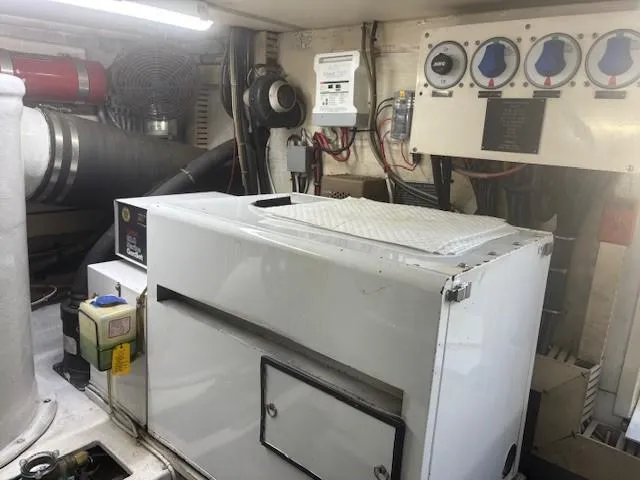 Dry-hydro Yacht Photos Pics Engine room of a 1990 Viking Convertible boat with machinery and control panels.