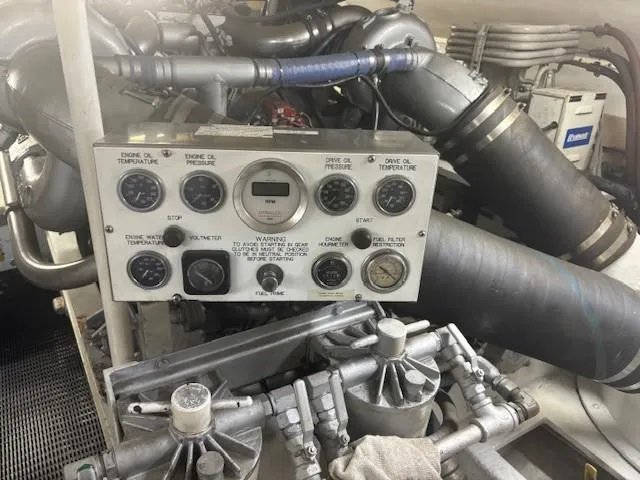 Dry-hydro Yacht Photos Pics Engine room of a 1990 Viking Convertible boat with control panel and gauges.