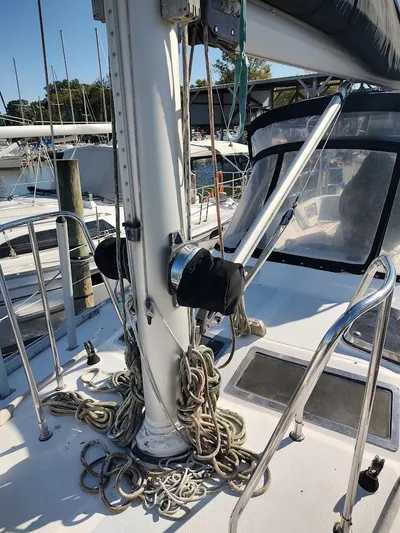 Trinity Yacht Photos Pics Sailboat deck of 1997 Hylas 46 with ropes and mast, docked at marina.
