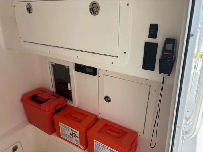 Must Sell!! Yacht Photos Pics Interior of 2016 Invincible 42 Open Fisherman with storage compartments and safety equipment.