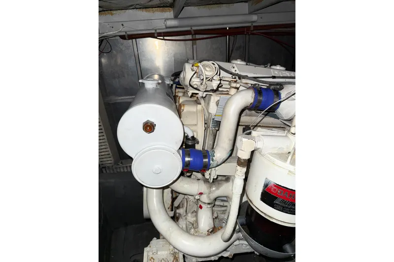  Yacht Photos Pics Engine compartment of 1989 Silverton 46 Aft Cabin boat, showcasing mechanical components.