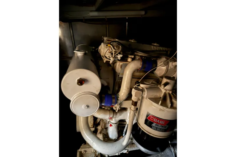  Yacht Photos Pics Engine room of 1989 Silverton 46 Aft Cabin yacht, featuring mechanical components.