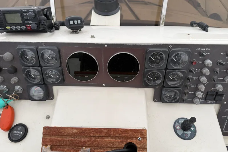  Yacht Photos Pics Control panel of a 1989 Silverton 46 Aft Cabin boat with gauges and switches.