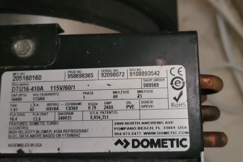 Freedom Yacht Photos Pics Close-up of Dometic compressor label with specifications and contact details.