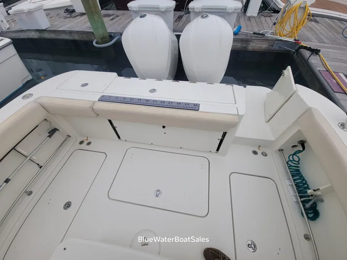  Yacht Photos Pics 2008 Hydra-Sports Vector 3500 VX boat deck with dual outboard motors at dock.