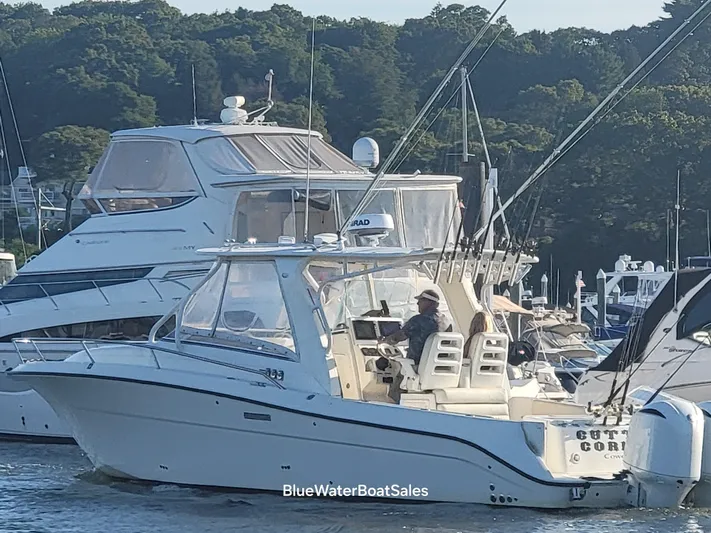  Yacht Photos Pics 2008 Hydra-Sports Vector 3500 VX boat docked in a marina, surrounded by other vessels.