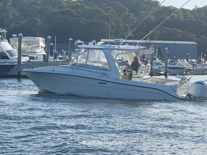  Yacht Photos Pics 2008 Hydra-Sports Vector 3500 VX boat cruising in a marina.