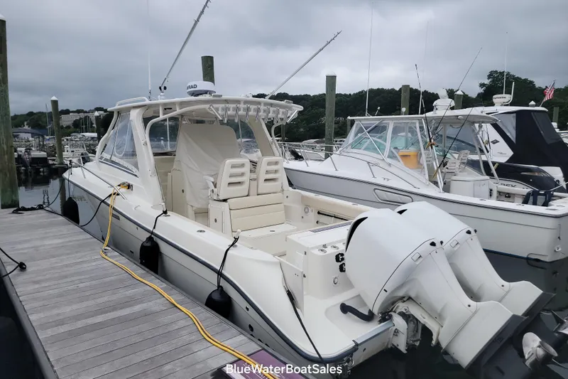  Yacht Photos Pics 2008 Hydra-Sports Vector 3500 VX boat docked at marina with fishing rods.