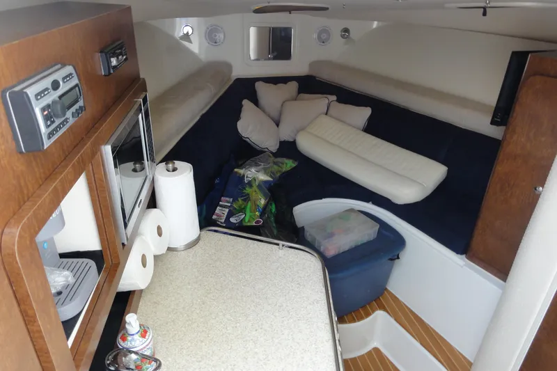  Yacht Photos Pics 2008 Hydra-Sports Vector 3500 VX cabin interior with seating, kitchenette, and storage.
