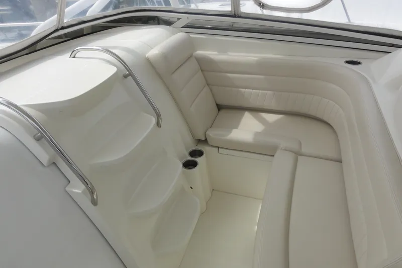  Yacht Photos Pics 2008 Hydra-Sports Vector 3500 VX boat interior with white cushioned seating and cup holders.