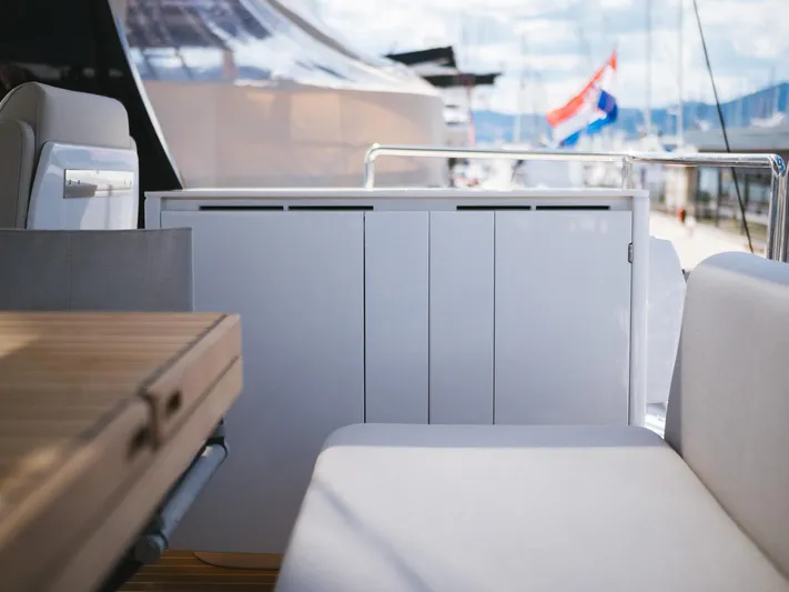 Blessed Yacht Photos Pics Luxurious Sunreef 50 A yacht interior, featuring sleek seating and a wooden table, 2024 model.