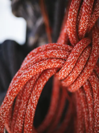 Blessed Yacht Photos Pics Close-up of red braided rope on a 2024 Sunreef 50 A yacht.