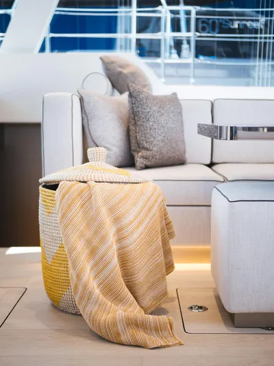 Blessed Yacht Photos Pics Luxurious interior of 2024 Sunreef 50 A yacht with cozy seating and decorative accents.