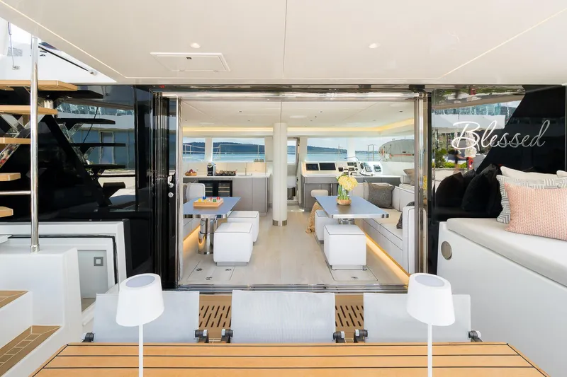 Blessed Yacht Photos Pics Luxurious interior of 2024 Sunreef 50 A yacht, featuring elegant seating and modern design.