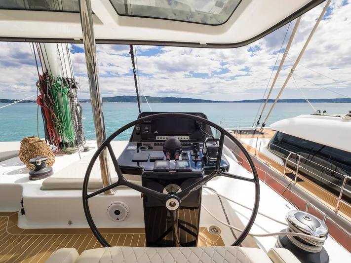 Blessed Yacht Photos Pics Helm of 2024 Sunreef 50 A yacht with ocean view and navigation equipment.