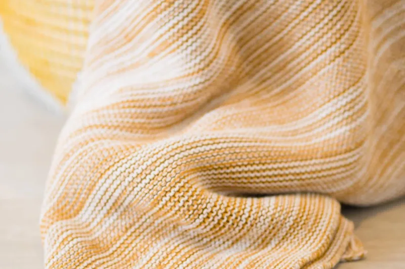 Blessed Yacht Photos Pics Close-up of a textured, striped fabric in warm tones, 2024 Sunreef 50 A.