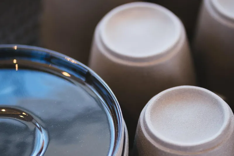 Blessed Yacht Photos Pics Close-up of stacked ceramic cups and a glossy plate, Sunreef 50 A, 2024 model.