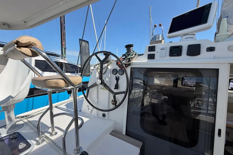 Strategery X Yacht Photos Pics Cockpit of 2014 Outremer 45 catamaran with steering wheel and navigation equipment.