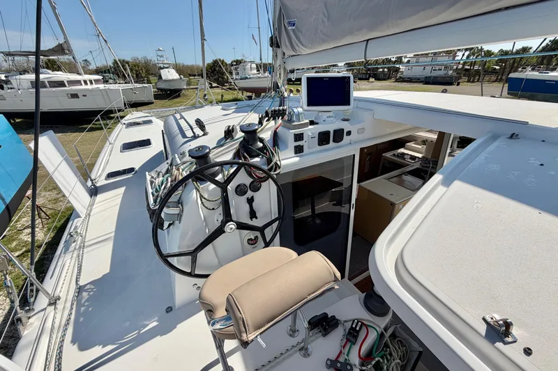 Strategery X Yacht Photos Pics Outremer 45 catamaran cockpit with steering wheel and navigation equipment, 2014 model.