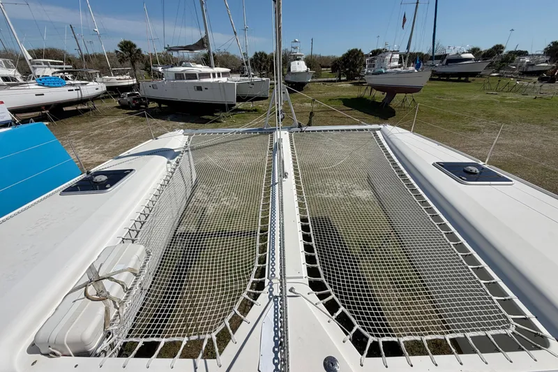 Strategery X Yacht Photos Pics 2014 Outremer 45 catamaran on land, showcasing deck and netting.