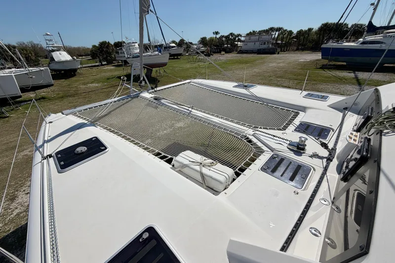 Strategery X Yacht Photos Pics 2014 Outremer 45 catamaran on land, showcasing deck and netting.