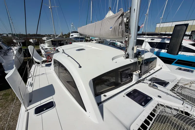 Strategery X Yacht Photos Pics 2014 Outremer 45 catamaran docked, showcasing sleek design and spacious deck.