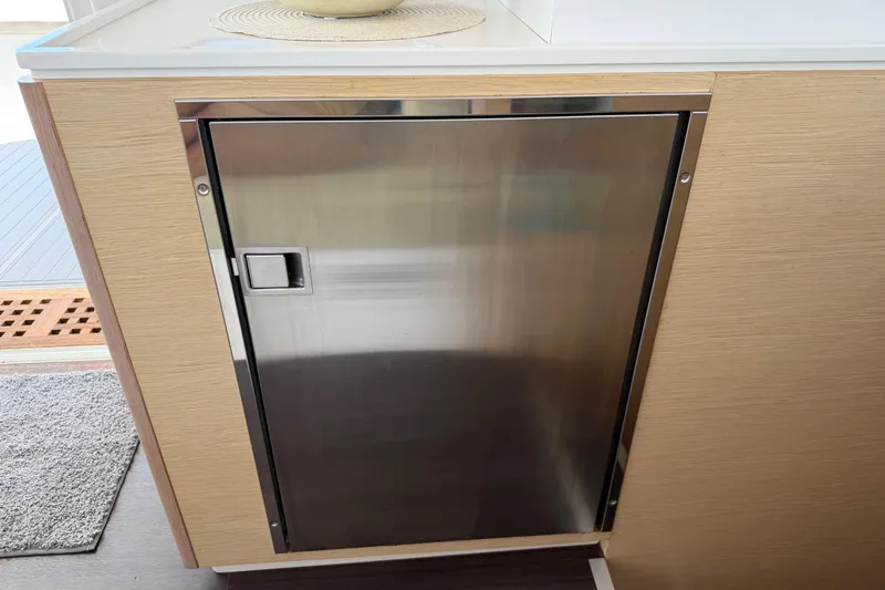 Strategery X Yacht Photos Pics Stainless steel cabinet door on 2014 Outremer 45 yacht interior.