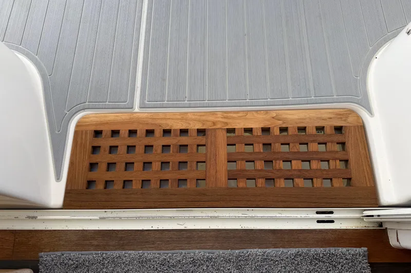 Strategery X Yacht Photos Pics Teak deck detail on 2014 Outremer 45 catamaran, featuring lattice design and gray flooring.