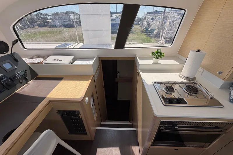 Strategery X Yacht Photos Pics Interior of a 2014 Outremer 45 yacht featuring a compact kitchen and navigation area.