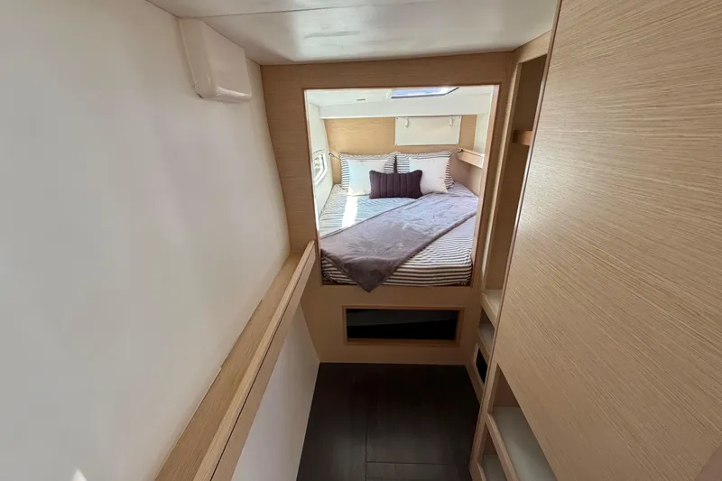 Strategery X Yacht Photos Pics Interior of 2014 Outremer 45 yacht, featuring a cozy bedroom with modern design.