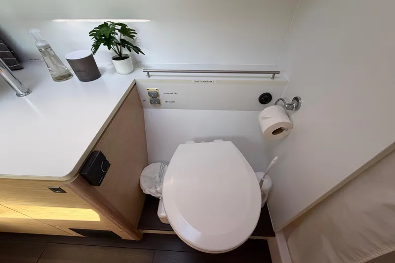 Strategery X Yacht Photos Pics Bathroom interior of 2014 Outremer 45 yacht with modern fixtures and decor.